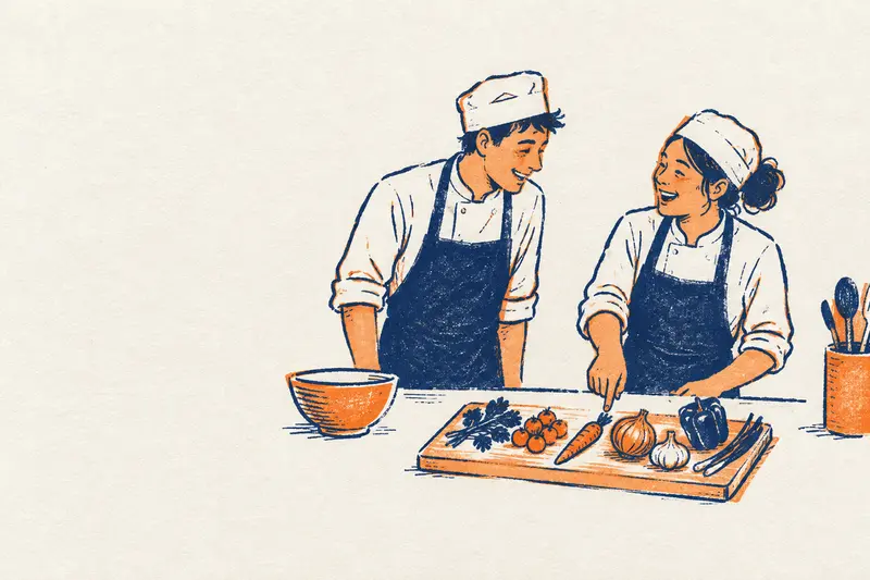 Una cocinera señala los ingredientes de una tabla a un compañero recién llegado y los dos se ríen